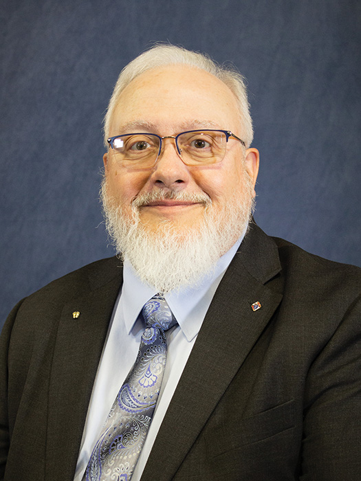 white haired man with beard