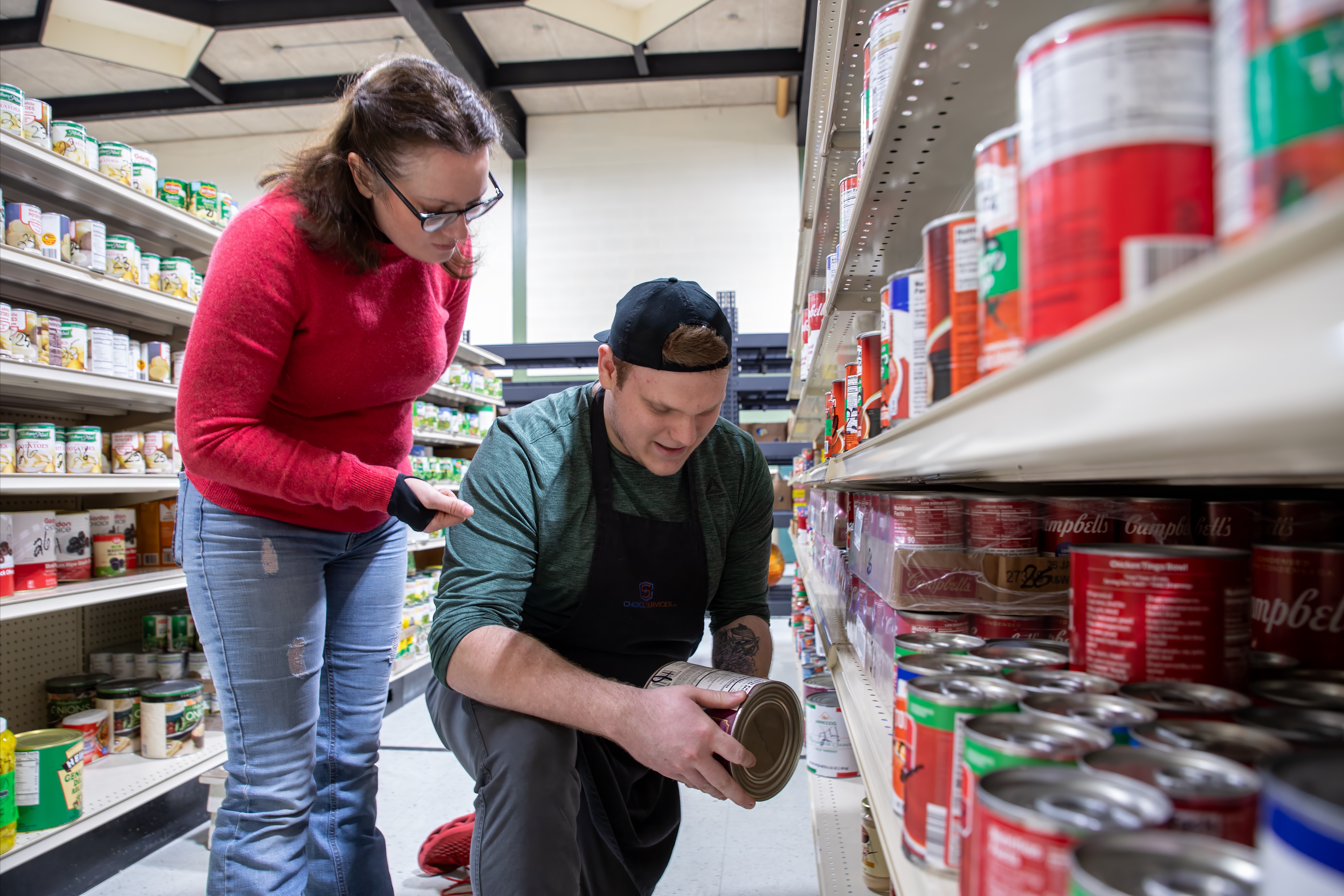 man and woman in food pantry