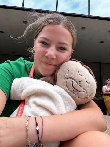 Annie Barnes holding Jesus stuffy