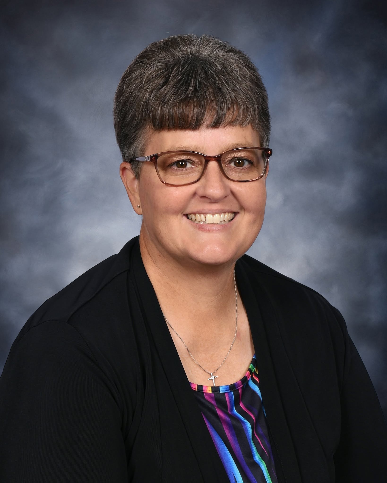 Older woman with short gray hair