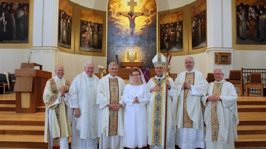 Mary with priests and bishop