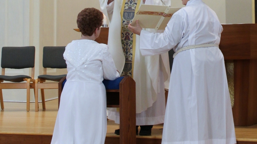 Mary kneeling with bishop being consecrated as a virgin