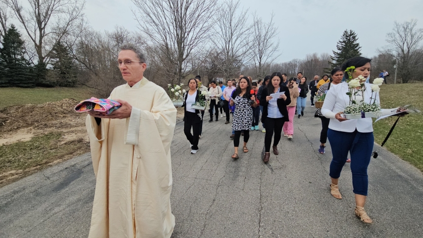 priest and parishioners processing