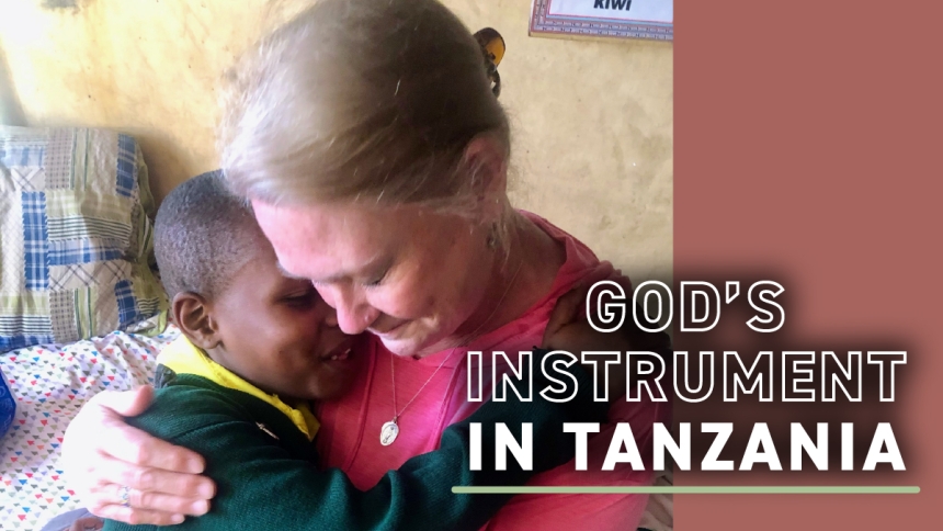 Cathy Taylor and Tanzanian boy hugging