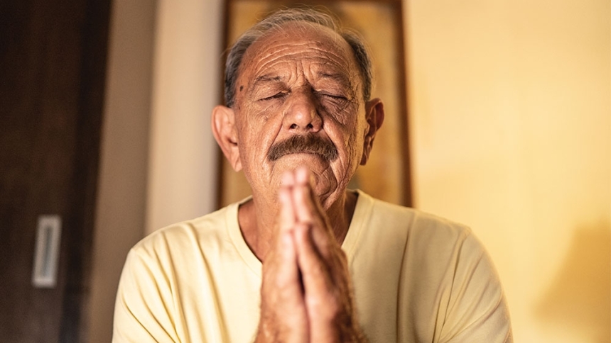 older man prayering
