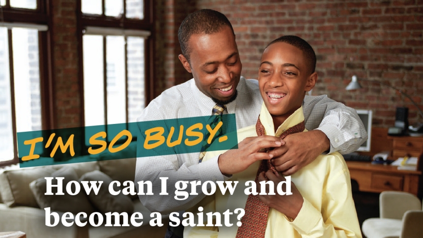 dad helping son put on tie