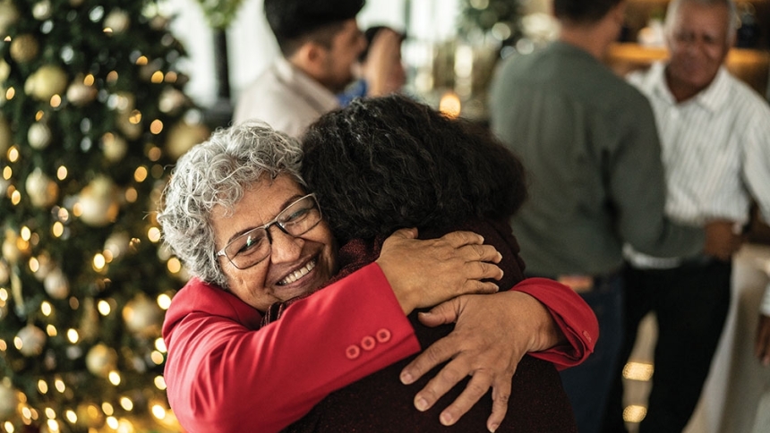 older woman embracing family member