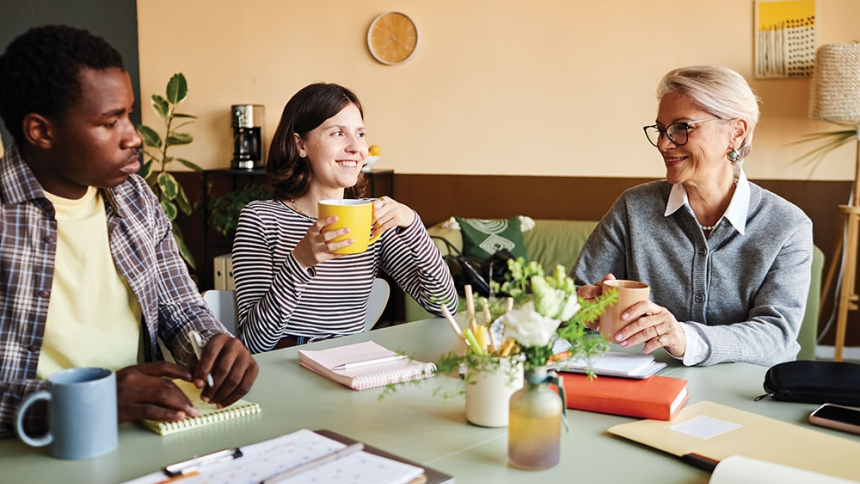 woman, man, and older woman in a meeting