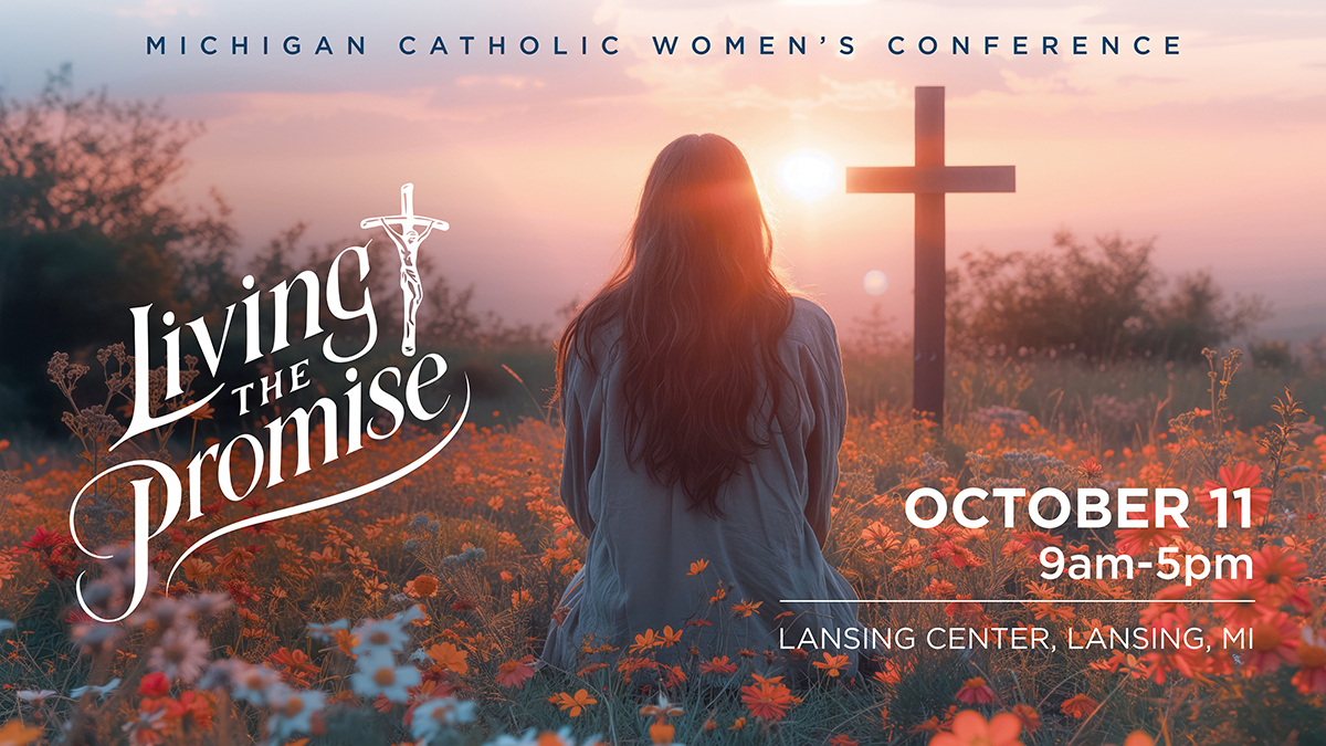 women in flower field sitting before a cross